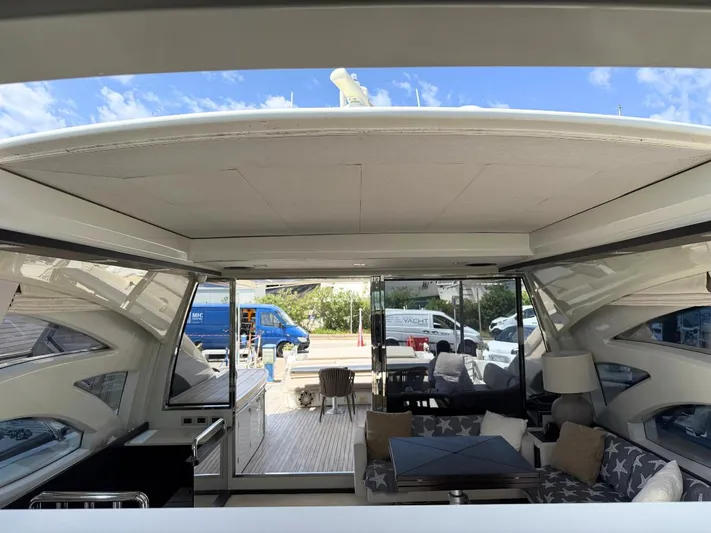  Yacht Photos Pics Luxurious interior of a 2006 Azimut 86S yacht with modern furnishings and open deck view.