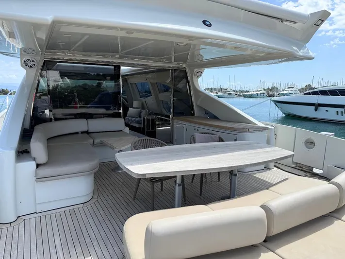  Yacht Photos Pics Luxurious 2006 Azimut 86S yacht with spacious outdoor seating and dining area.