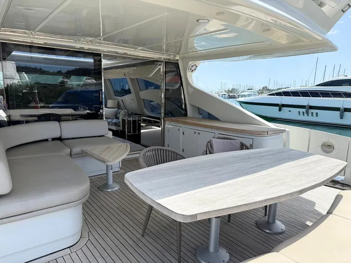  Yacht Photos Pics Luxurious 2006 Azimut 86S yacht with elegant outdoor seating and dining area.