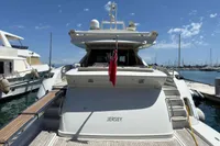 Azimut 86S 2006 yacht docked at marina, rear view with Jersey flag.