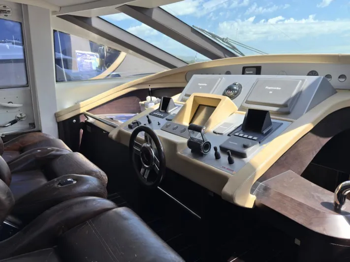  Yacht Photos Pics Luxurious 2006 Azimut 86S yacht cockpit with modern navigation controls and leather seating.