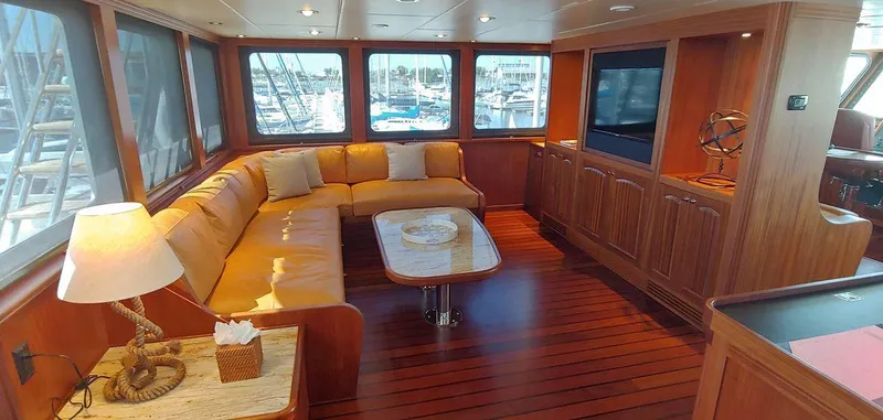 Allseas Yacht Photos Pics Luxurious interior of 2016 Allseas Expedition 92 yacht with wooden flooring and plush seating.