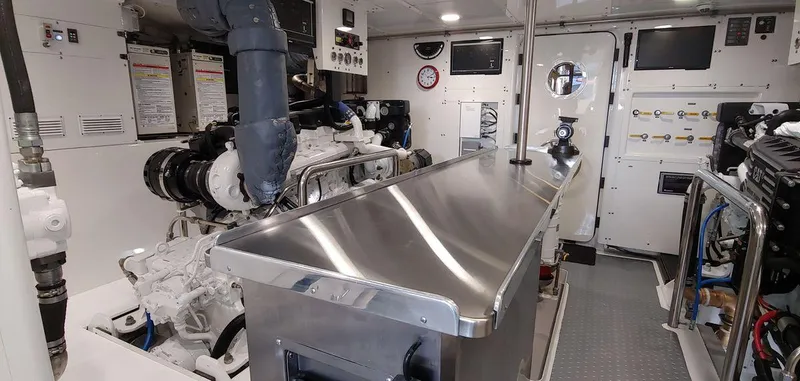 Allseas Yacht Photos Pics Engine room of 2016 Allseas Expedition 92 yacht with stainless steel surfaces and control panels.