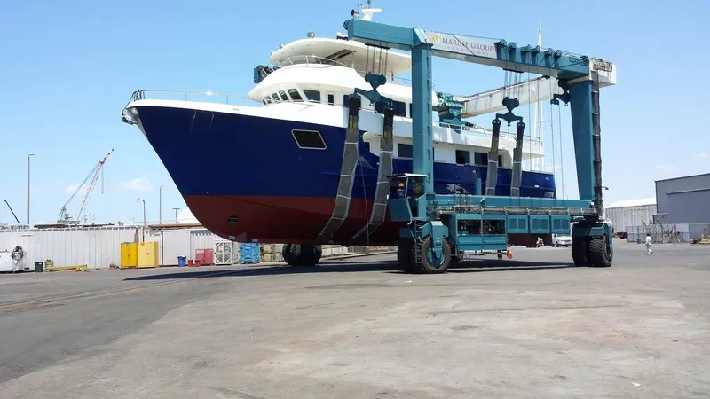 Allseas Yacht Photos Pics Allseas Expedition 92 yacht, 2016 model, on a ship lift at a dockyard.