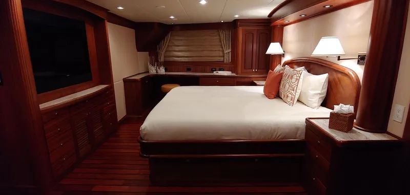 Allseas Yacht Photos Pics Luxurious bedroom interior of 2016 Allseas Expedition 92 yacht with wooden furnishings.
