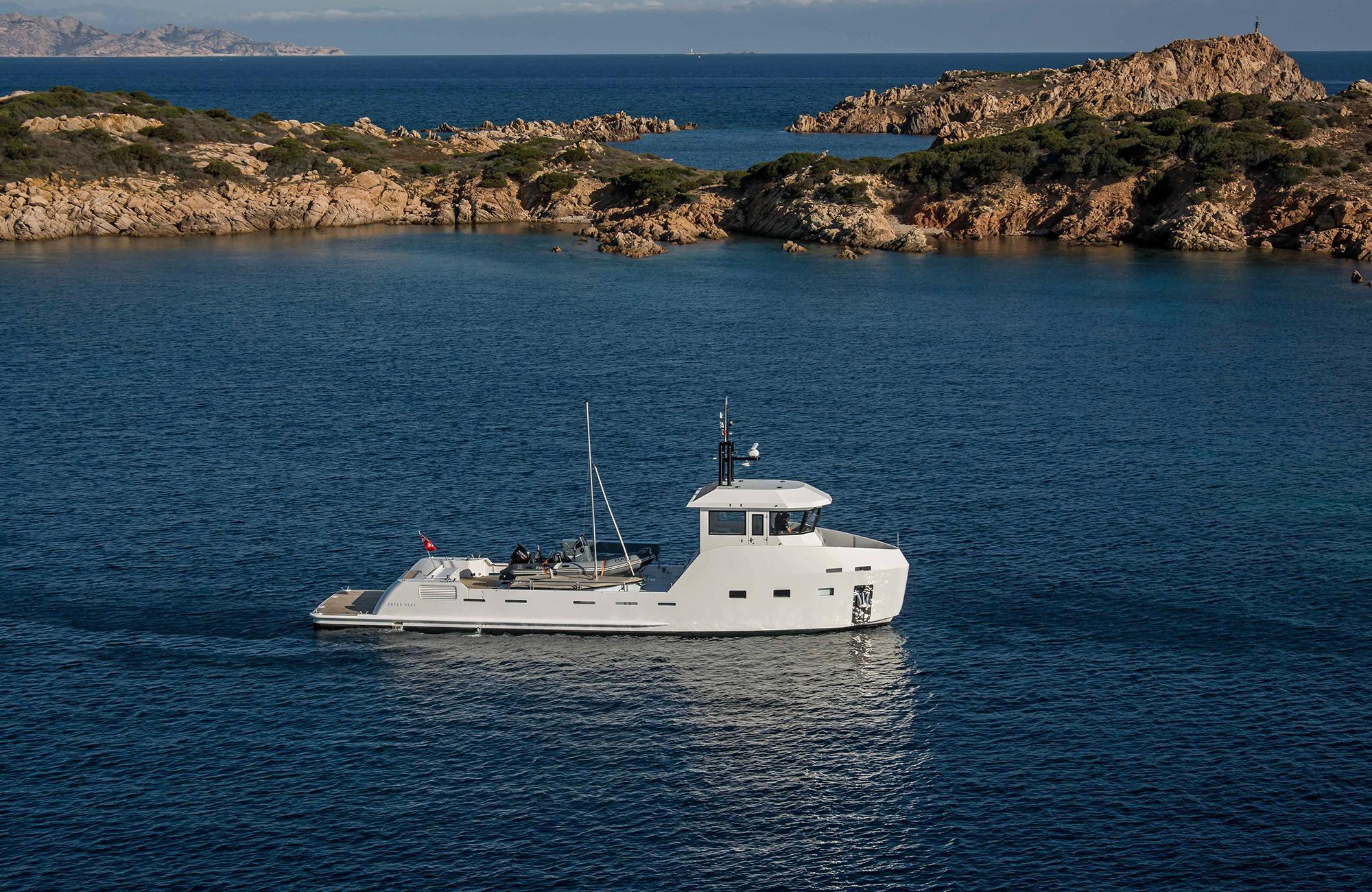 Outer Reef Yachts 20 YXT 2027 cruising in scenic coastal waters.