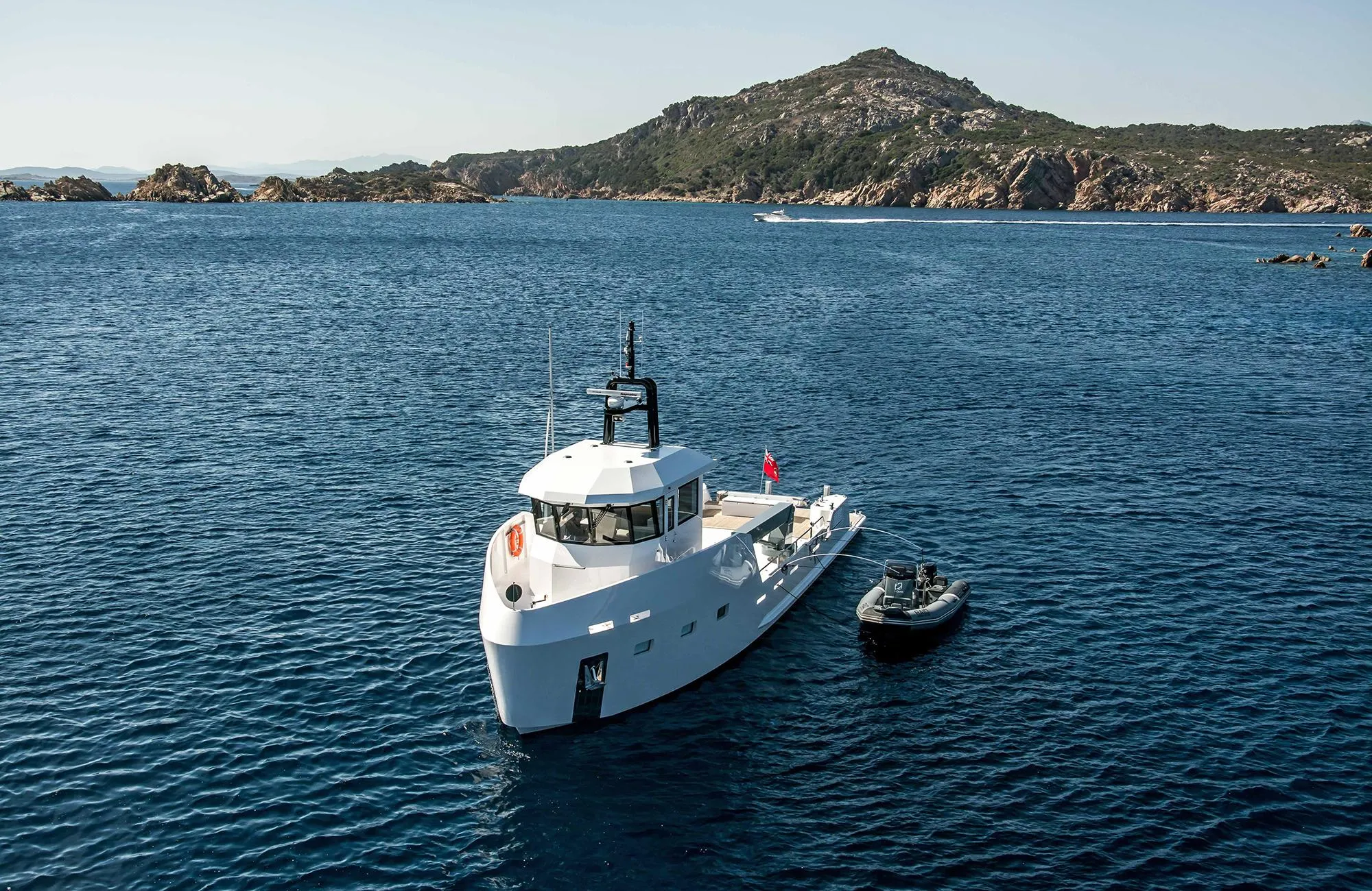 Outer Reef Yachts 20 YXT 2027 cruising in scenic coastal waters.