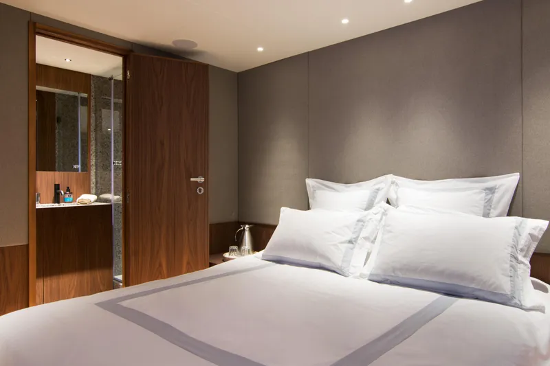 Whisper V Yacht Photos Pics Luxurious bedroom on 2002 Ferretti Yachts 112 Custom Line with ensuite bathroom.