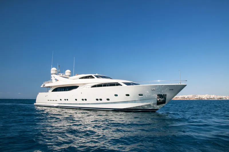 Whisper V Yacht Photos Pics Luxury Ferretti Yachts 112 Custom Line, 2002 model, cruising on open sea under clear blue sky.