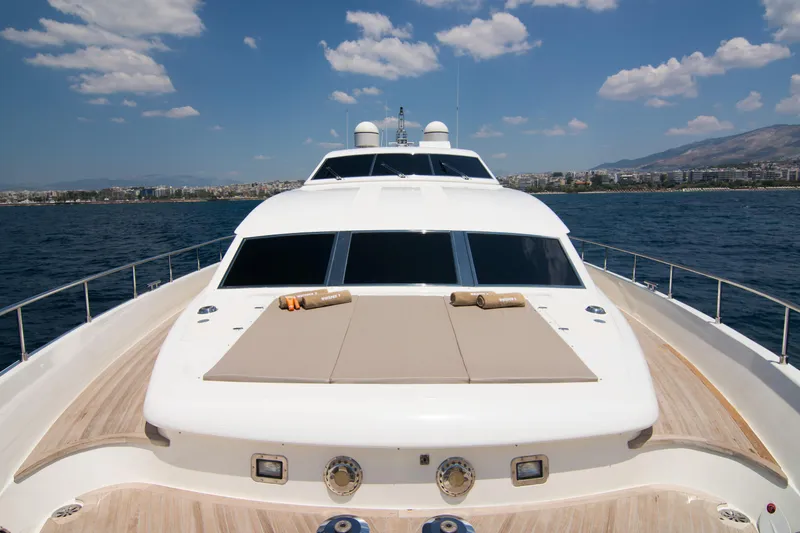 Whisper V Yacht Photos Pics Ferretti Yachts 112 Custom Line 2002 on open sea with sunbathing deck.