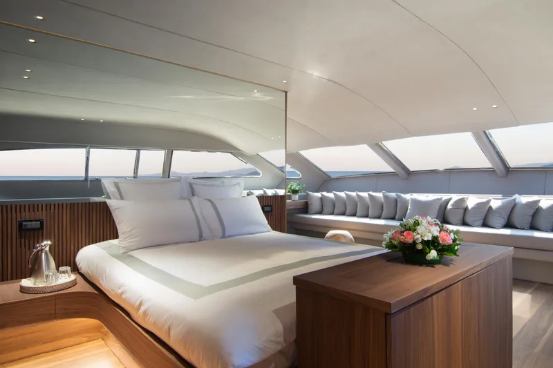 Whisper V Yacht Photos Pics Luxurious bedroom interior of 2002 Ferretti Yachts 112 Custom Line with elegant design and natural light.