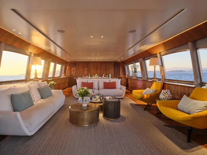 Whisper V Yacht Photos Pics Luxurious interior of 2002 Ferretti Yachts 112 Custom Line, featuring elegant seating and ocean views.