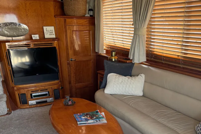 Knot 2 Late Yacht Photos Pics Interior of 2003 Navigator 57 Rival yacht with cozy seating and entertainment area.