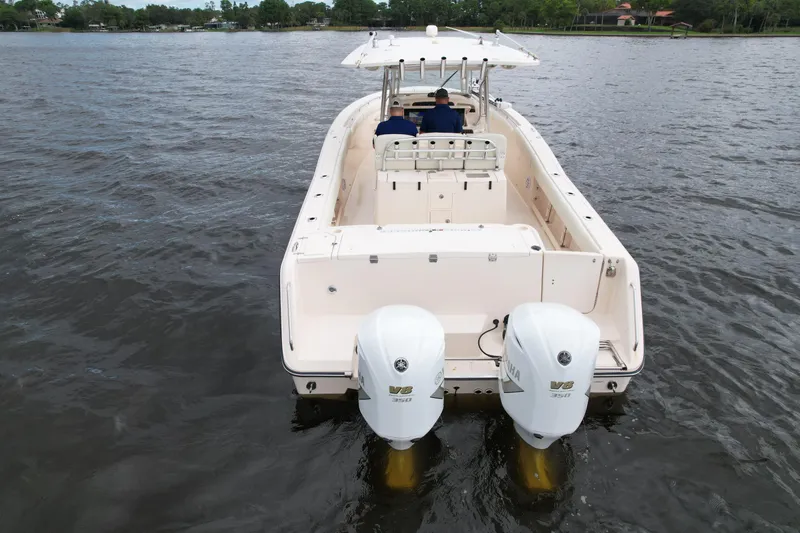  Yacht Photos Pics 2008 Grady-White Canyon 336 boat with dual engines on a calm lake.