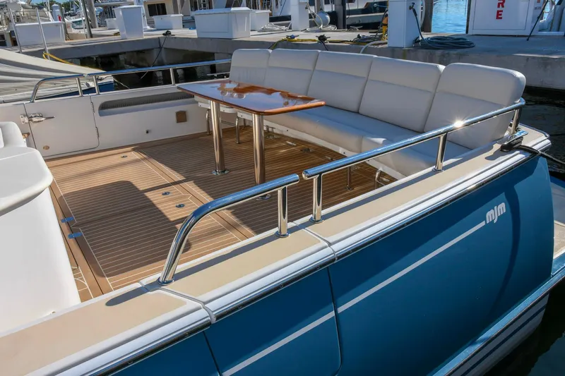 Future 7 Yacht Photos Pics Luxury deck of 2018 MJM 50z yacht with seating and table.