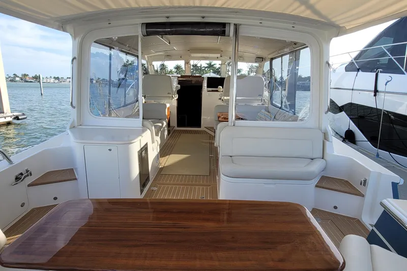 Future 7 Yacht Photos Pics Luxurious 2018 MJM 50z yacht interior with elegant seating and wooden table.