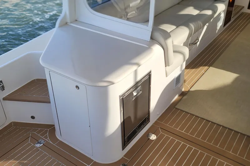 Future 7 Yacht Photos Pics 2018 MJM 50z yacht interior with cushioned seating and sleek cabinetry.