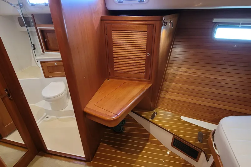 Future 7 Yacht Photos Pics Interior of 2018 MJM 50z yacht featuring wooden cabinetry and bathroom.