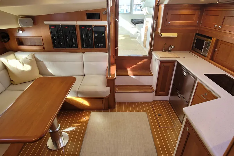 Future 7 Yacht Photos Pics Luxurious interior of 2018 MJM 50z yacht with modern kitchen and seating area.