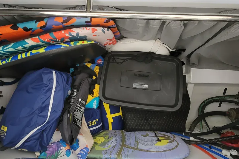 Future 7 Yacht Photos Pics Storage compartment in 2018 MJM 50z boat with colorful gear and equipment.