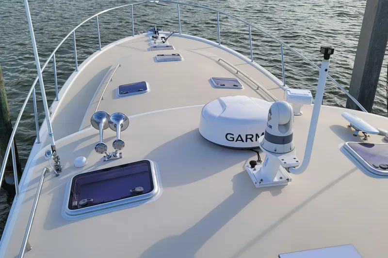Future 7 Yacht Photos Pics 2018 MJM 50z yacht deck with Garmin equipment, docked on calm water.