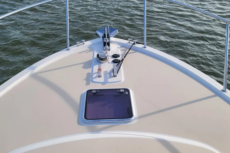 Future 7 Yacht Photos Pics Bow of 2018 MJM 50z yacht with anchor and hatch, on calm water.