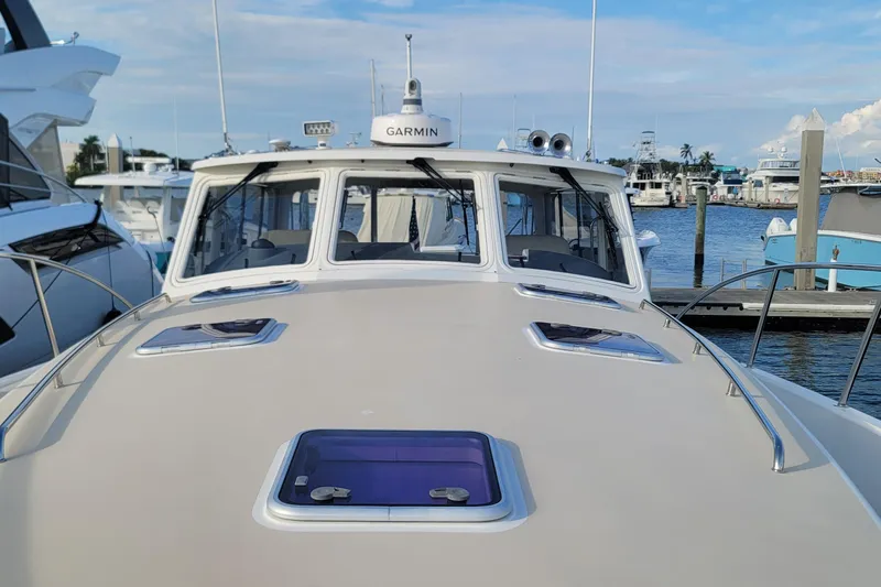 Future 7 Yacht Photos Pics 2018 MJM 50z yacht docked at marina, featuring Garmin navigation system.