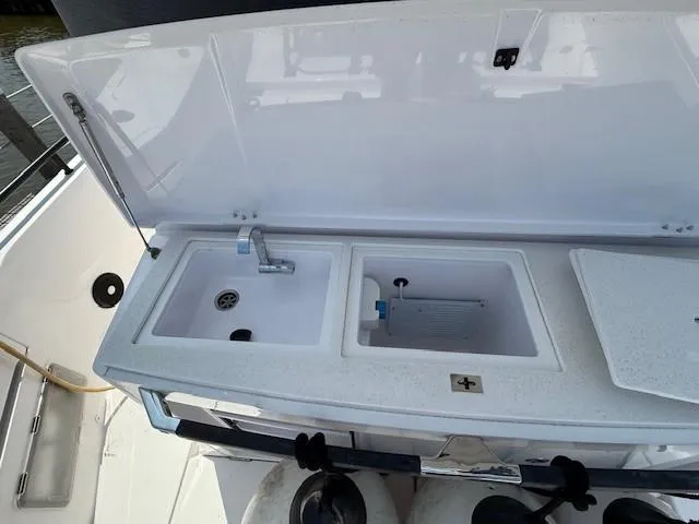  Yacht Photos Pics Outdoor sink and storage on 2021 Axopar 37 XC CROSS CABIN boat.