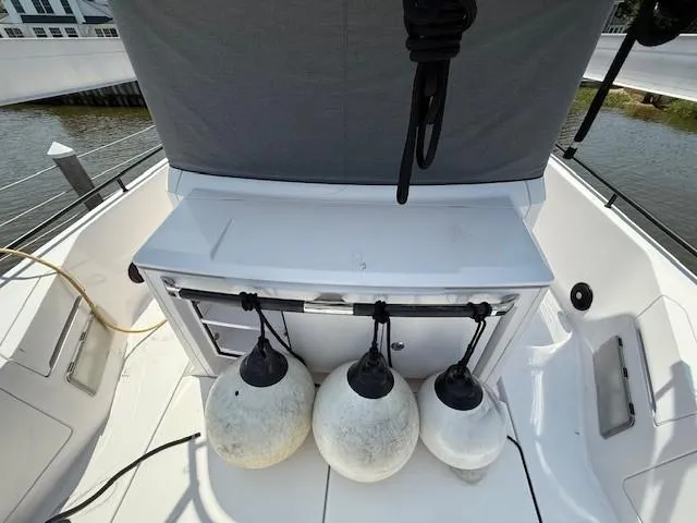  Yacht Photos Pics 2021 Axopar 37 XC CROSS CABIN boat deck with fenders and storage.