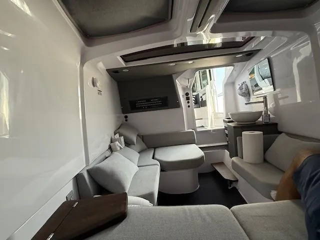  Yacht Photos Pics Interior of 2021 Axopar 37 XC CROSS CABIN, featuring modern seating and sleek design.