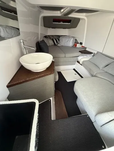  Yacht Photos Pics Interior of 2021 Axopar 37 XC CROSS CABIN with modern seating and compact sink.