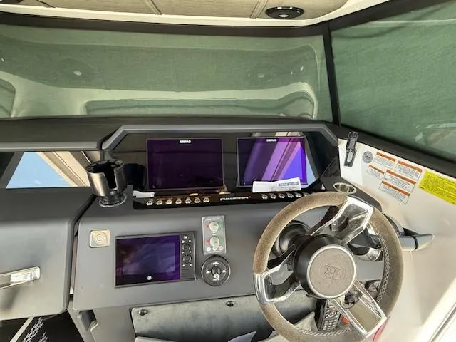  Yacht Photos Pics 2021 Axopar 37 XC CROSS CABIN helm with dual screens and modern steering wheel.