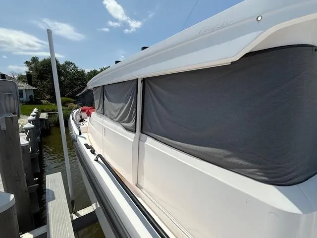  Yacht Photos Pics 2021 Axopar 37 XC CROSS CABIN docked, side view with covered windows.