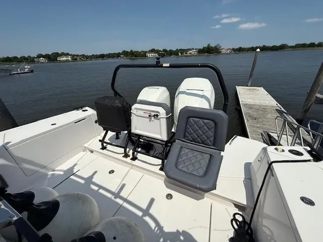  Yacht Photos Pics 2021 Axopar 37 XC CROSS CABIN boat with dual engines docked by a serene lake.