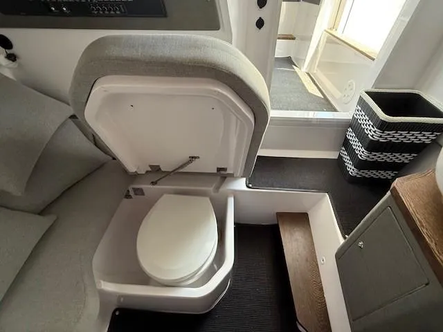  Yacht Photos Pics 2021 Axopar 37 XC CROSS CABIN interior with compact marine toilet.