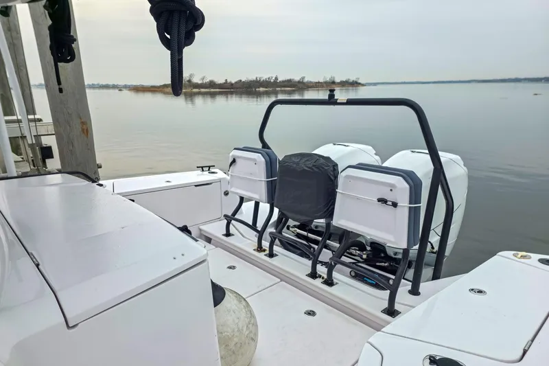  Yacht Photos Pics 2021 Axopar 37 XC Cross Cabin boat with dual engines on a calm lake.