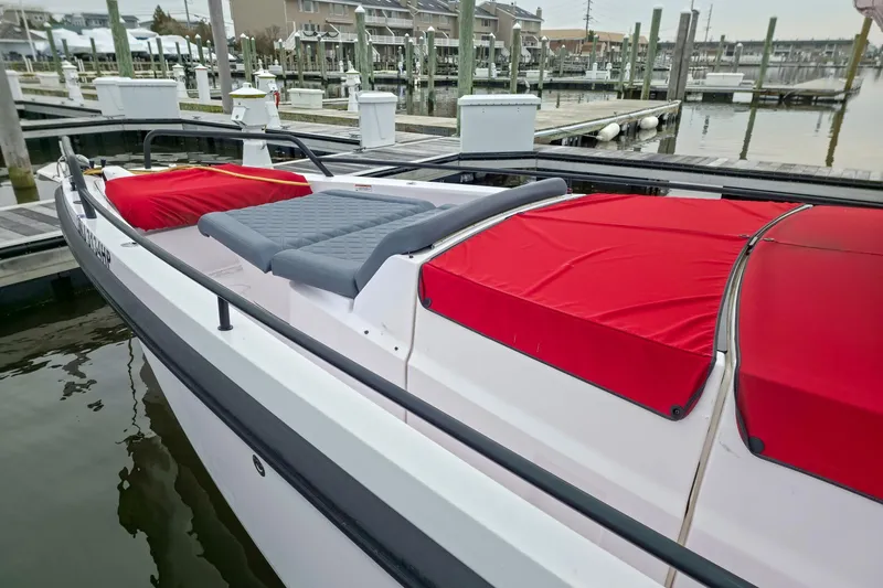  Yacht Photos Pics 2021 Axopar 37 XC Cross Cabin boat with red covers docked at marina.