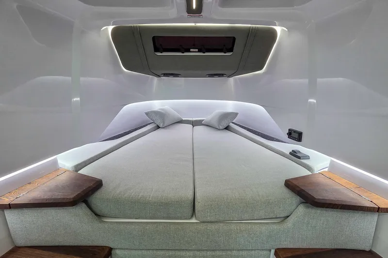  Yacht Photos Pics Luxurious interior cabin of 2021 Axopar 37 XC Cross Cabin with modern bedding.