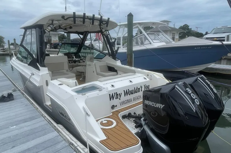 Why Wouldn't You Yacht Photos Pics 2023 Boston Whaler 280 Vantage boat docked, featuring dual Mercury engines.