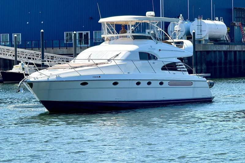  Yacht Photos Pics 2000 Fairline Squadron 56 yacht docked near Hinckley building.