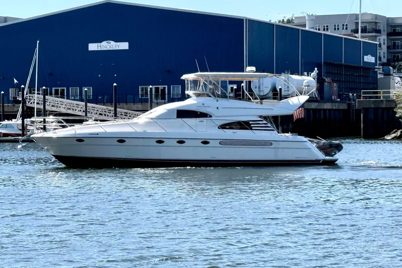  Yacht Photos Pics Luxury Fairline Squadron 56 yacht from 2000 cruising near a marina.