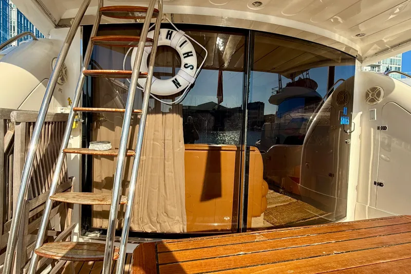  Yacht Photos Pics Fairline Squadron 56 yacht, 2000 model, featuring a wooden deck and glass doors.