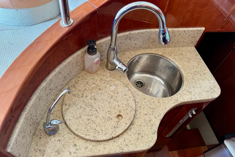  Yacht Photos Pics Luxury yacht Fairline Squadron 56, 2000 model, featuring a compact kitchen sink area.