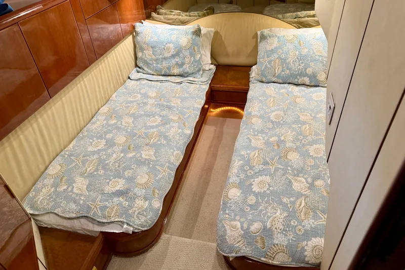 Yacht Photos Pics Twin beds with seashell-patterned bedding in a 2000 Fairline Squadron 56 yacht cabin.
