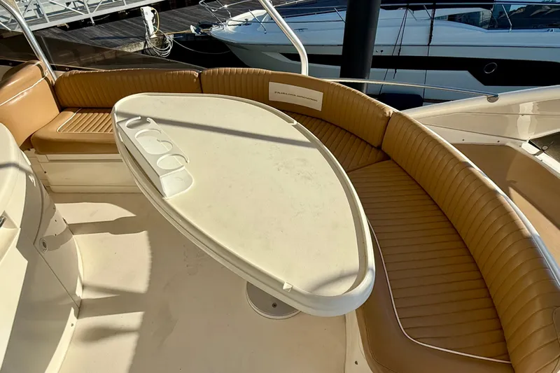  Yacht Photos Pics Luxurious seating area on 2000 Fairline Squadron 56 yacht with oval table.