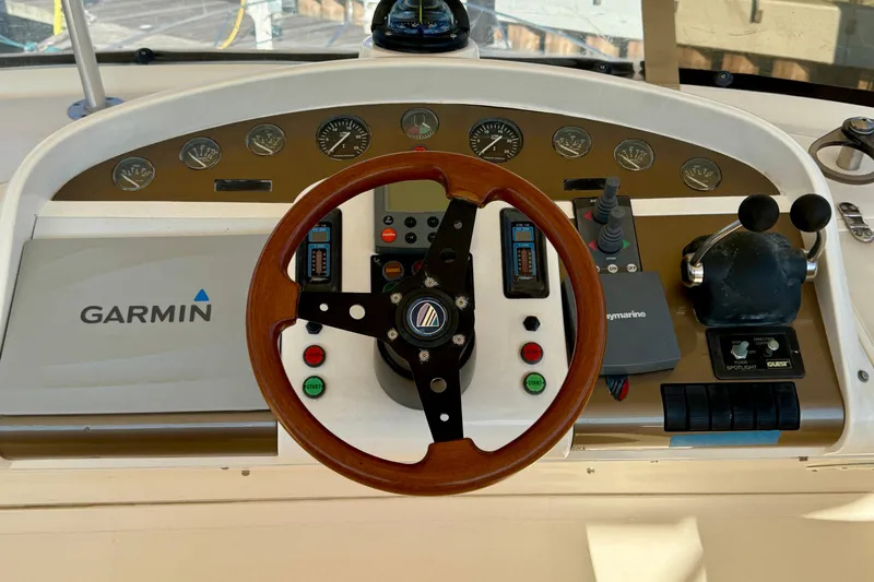  Yacht Photos Pics Cockpit of 2000 Fairline Squadron 56 yacht with Garmin navigation system and wooden steering wheel.