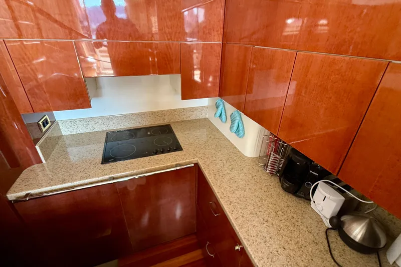  Yacht Photos Pics Luxurious kitchen in 2000 Fairline Squadron 56 yacht with sleek wood cabinetry.