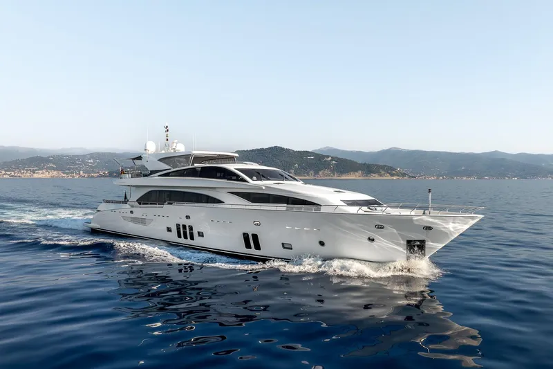 Arion Yacht Photos Pics Luxurious 2011 Guy Couach 121' yacht cruising on serene blue waters.