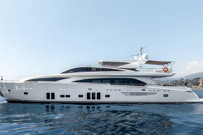 Arion Yacht Photos Pics Luxurious 2011 Guy Couach 121' yacht on calm sea, clear sky backdrop.