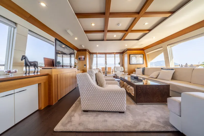 Arion Yacht Photos Pics Luxurious interior of 2011 Guy Couach 121' yacht with elegant furnishings and panoramic windows.